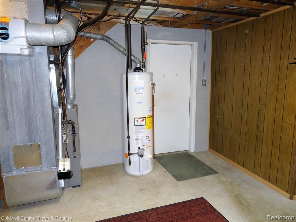 4651 Maybee Road Clarkston, MI 48348 - Photo 29 of 45 Furnace and A/C (2006) and water heater (2008). Entrance to the garage.