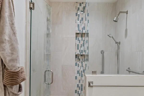 a view of a house with garden and a tree