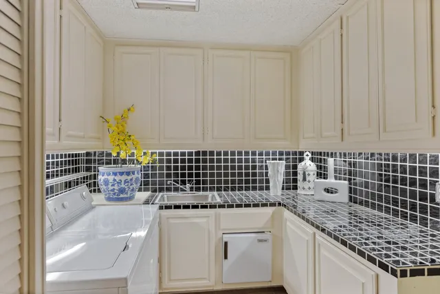 a view of a swimming pool with a table and chairs