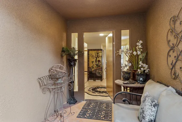 a bedroom with furniture and a window