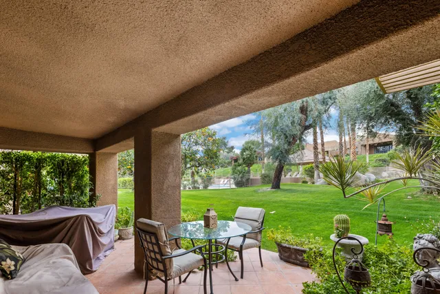 a view of yard with seating area and green space