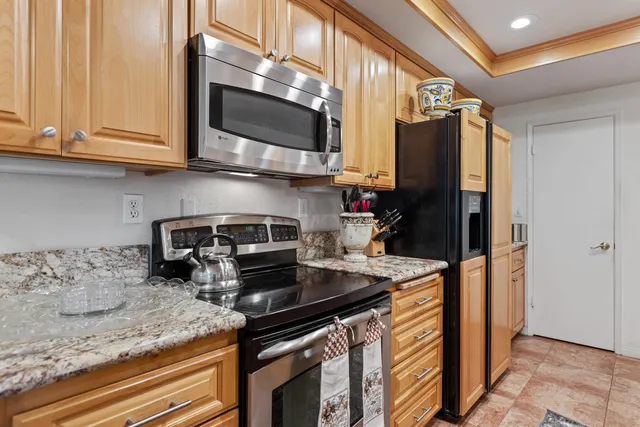 a bathroom with a bathtub a shower and a window