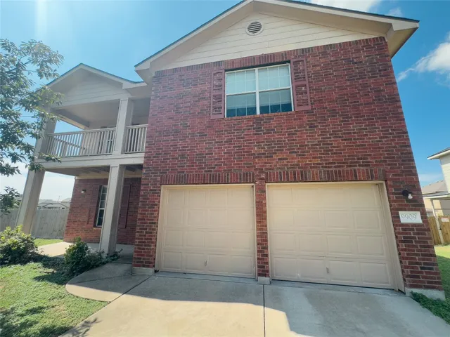 a view of a livingroom with furniture and wooden floor