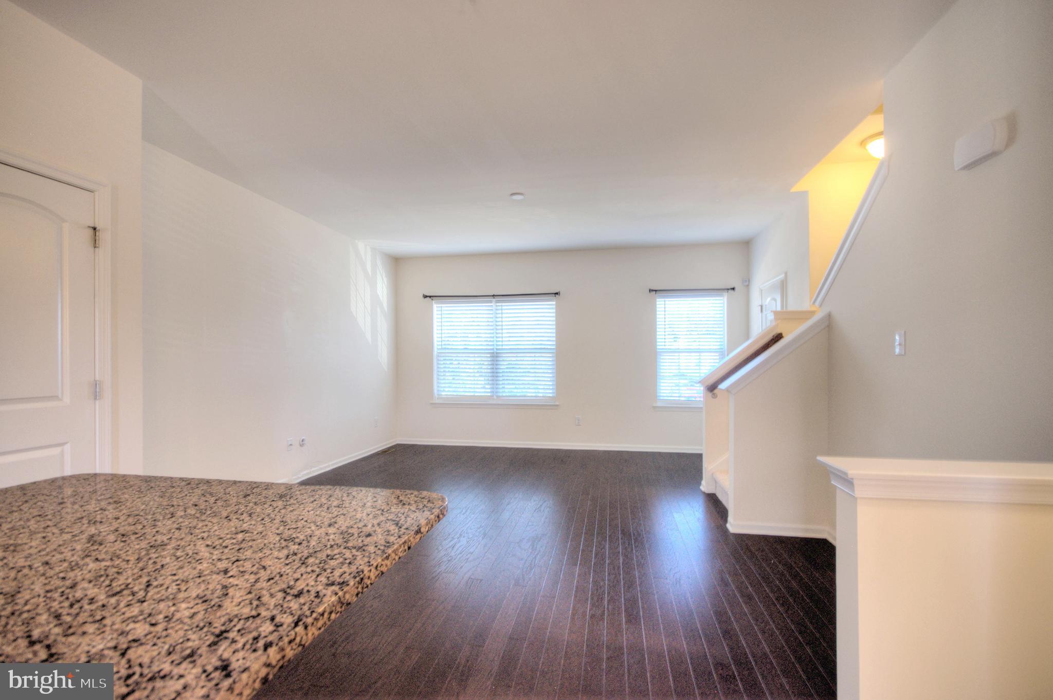 58 Iron Gate Road Marlton, NJ 08053 - Photo 15 of 47 a view of an empty room with wooden floor and a window