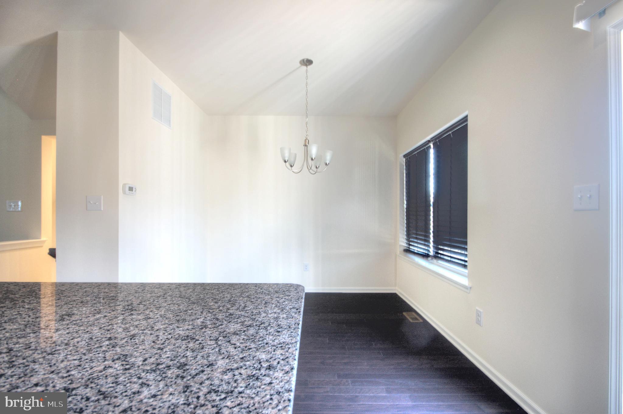 58 Iron Gate Road Marlton, NJ 08053 - Photo 18 of 47 a view of an empty room with wooden floor and a window