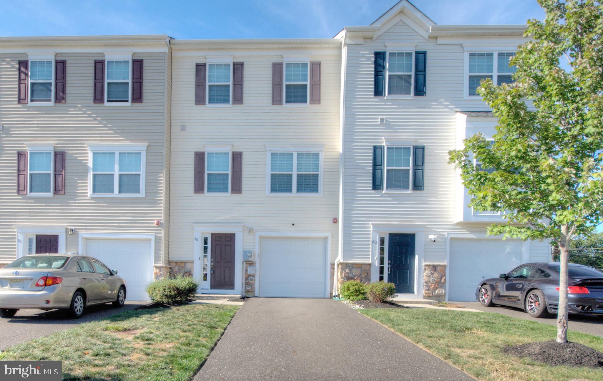 58 Iron Gate Road Marlton, NJ 08053 - Photo 2 of 47 a front view of a house with a garden and parking
