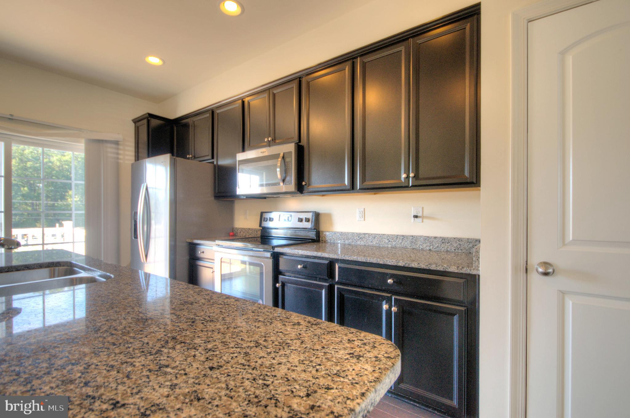 58 Iron Gate Road Marlton, NJ 08053 - Photo 27 of 47 a kitchen with stainless steel appliances granite countertop a stove a sink and a refrigerator