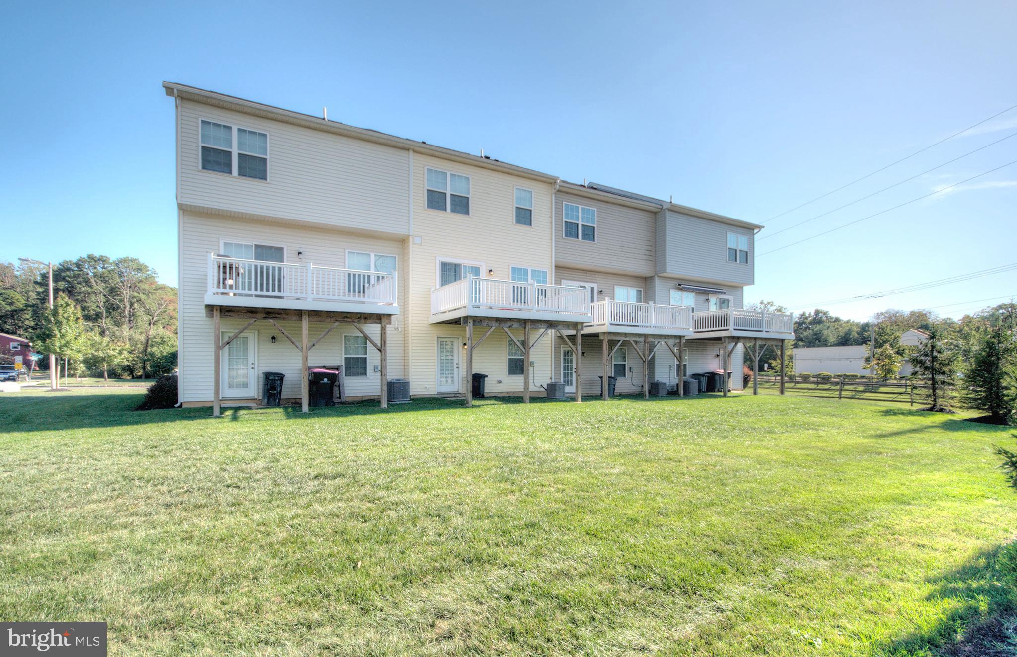 58 Iron Gate Road Marlton, NJ 08053 - Photo 5 of 47 a view of a big yard next to a yard with plants and large trees