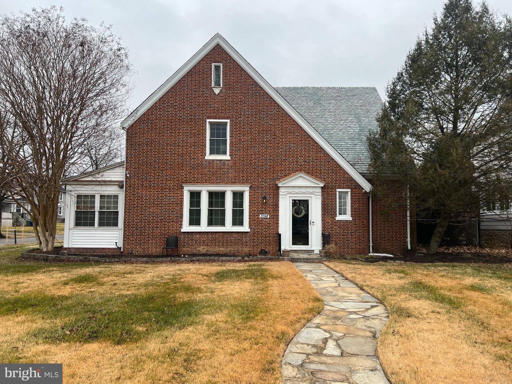 3318 Dorchester Road Baltimore, MD 21215 - Photo 3 of 5 a front view of house with yard