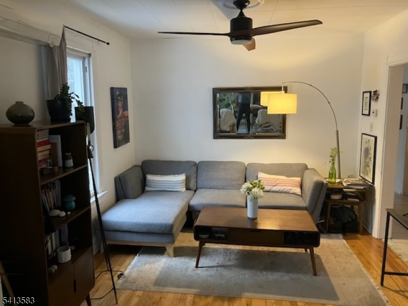 32 Pitt Street Bloomfield, NJ 07003 - Photo 4 of 10 a living room with furniture and a flat screen tv
