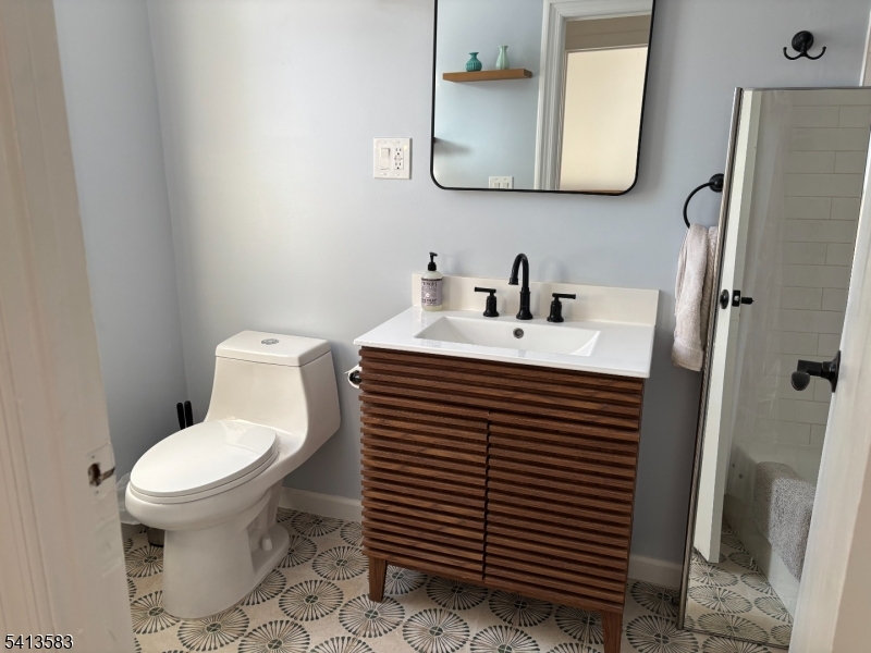 32 Pitt Street Bloomfield, NJ 07003 - Photo 7 of 10 a white toilet sitting next to a bathroom sink