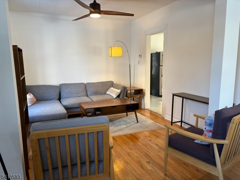 32 Pitt Street Bloomfield, NJ 07003 - Photo 9 of 10 a living room with furniture and wooden floor