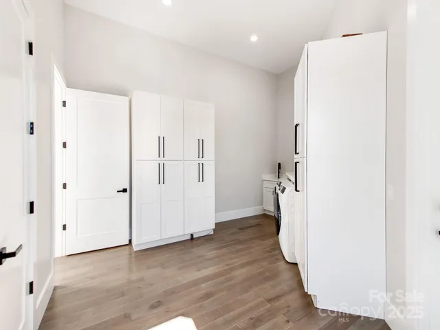 a view of entryway with wooden floor