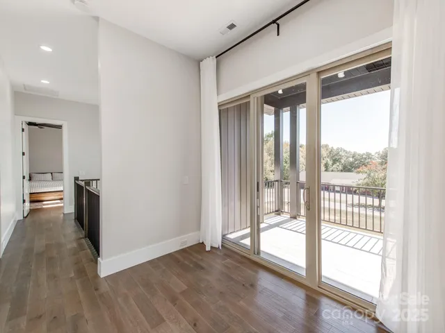 a view of a large window with wooden floor