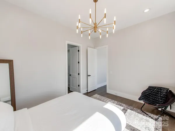 a bedroom with a bed and cabinets