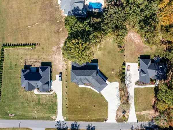 aerial view of a house with a yard