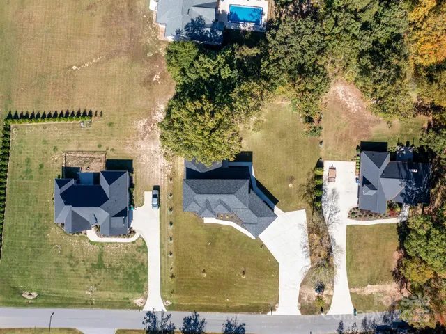 aerial view of a house with a yard