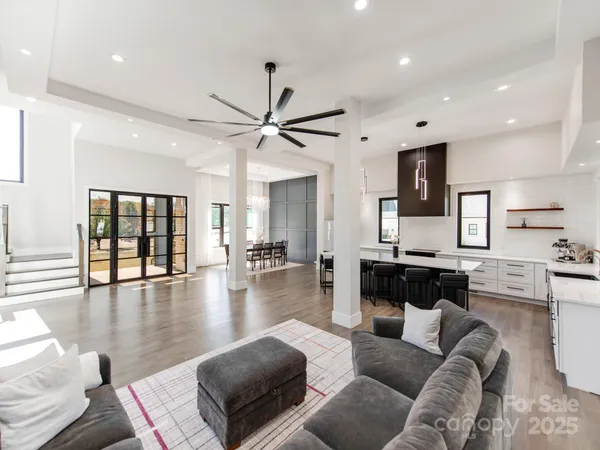 a living room with furniture or kitchen and a wooden floor