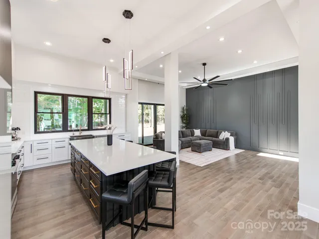 a large kitchen with a table and chairs