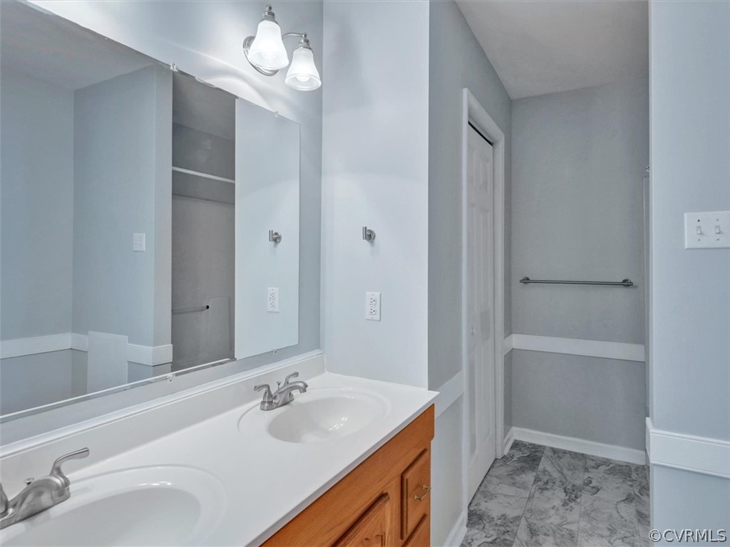 9201 Cattail Road Chesterfield, VA 23838 - Photo 14 of 35 a bathroom with a sink a toilet and shower