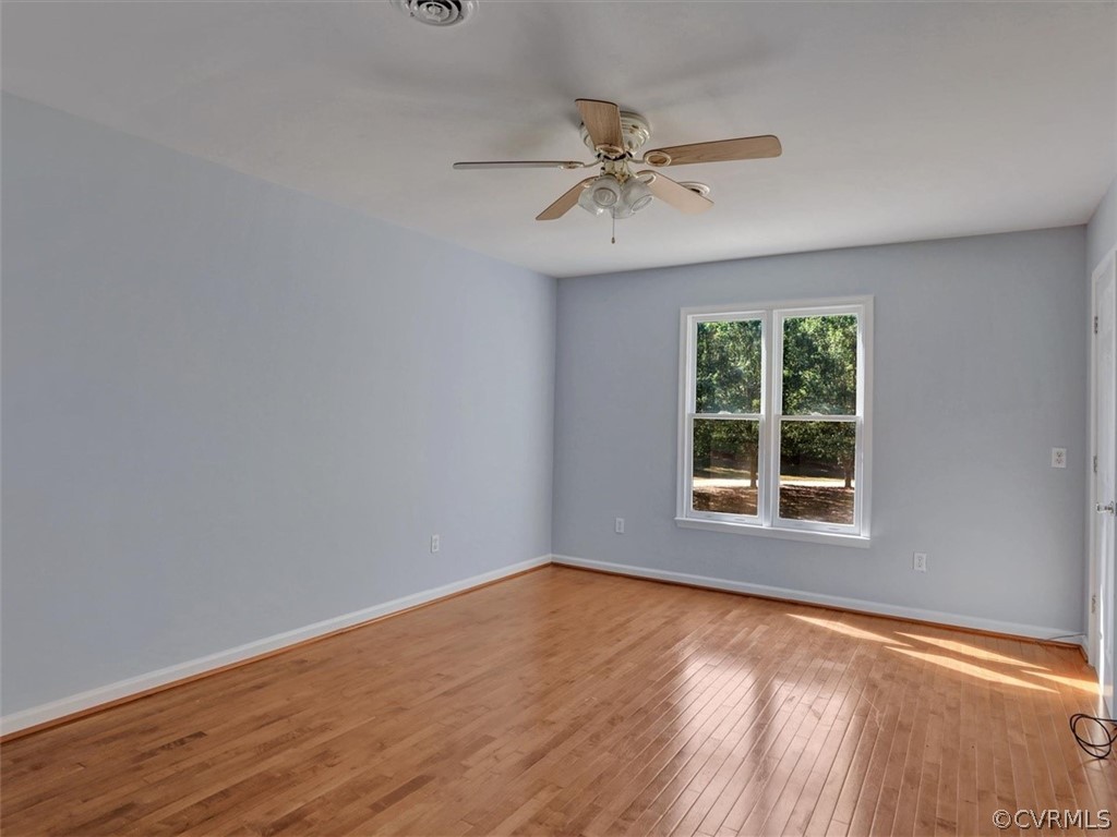 9201 Cattail Road Chesterfield, VA 23838 - Photo 15 of 35 a view of an empty room with wooden floor and a window