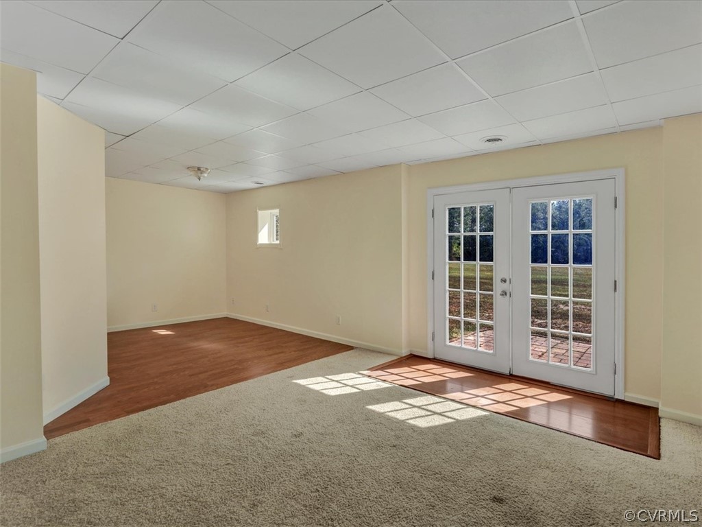 9201 Cattail Road Chesterfield, VA 23838 - Photo 16 of 35 an empty room with wooden floor and windows