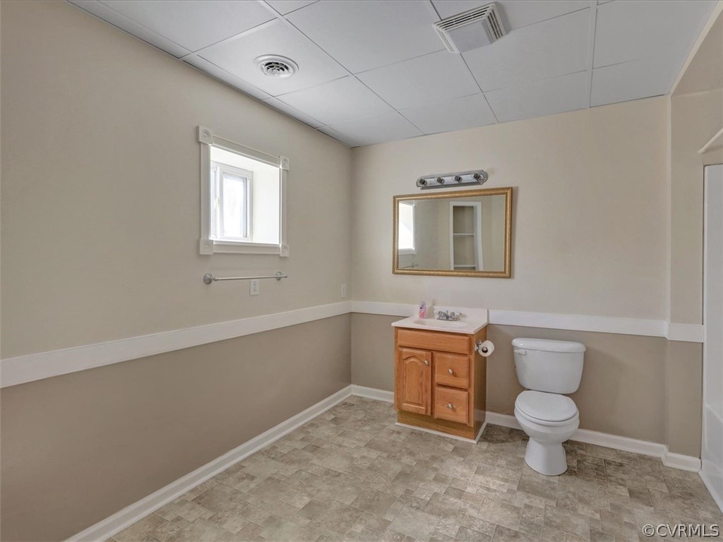 9201 Cattail Road Chesterfield, VA 23838 - Photo 18 of 35 a bathroom with a toilet a sink and mirror