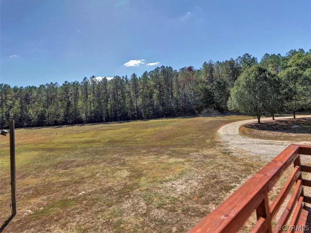 9201 Cattail Road Chesterfield, VA 23838 - Photo 24 of 35 a view of a swimming pool with trees in the background