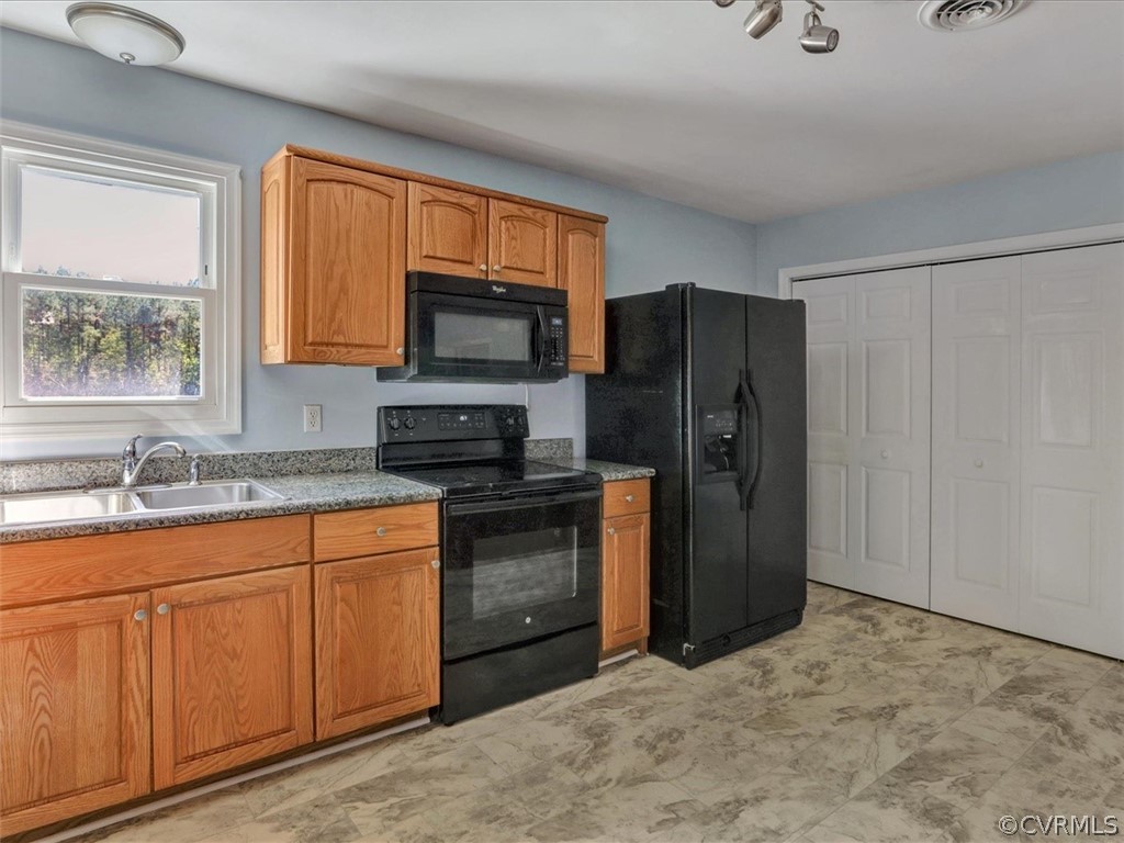 9201 Cattail Road Chesterfield, VA 23838 - Photo 10 of 35 a kitchen with stainless steel appliances granite countertop a refrigerator stove and sink