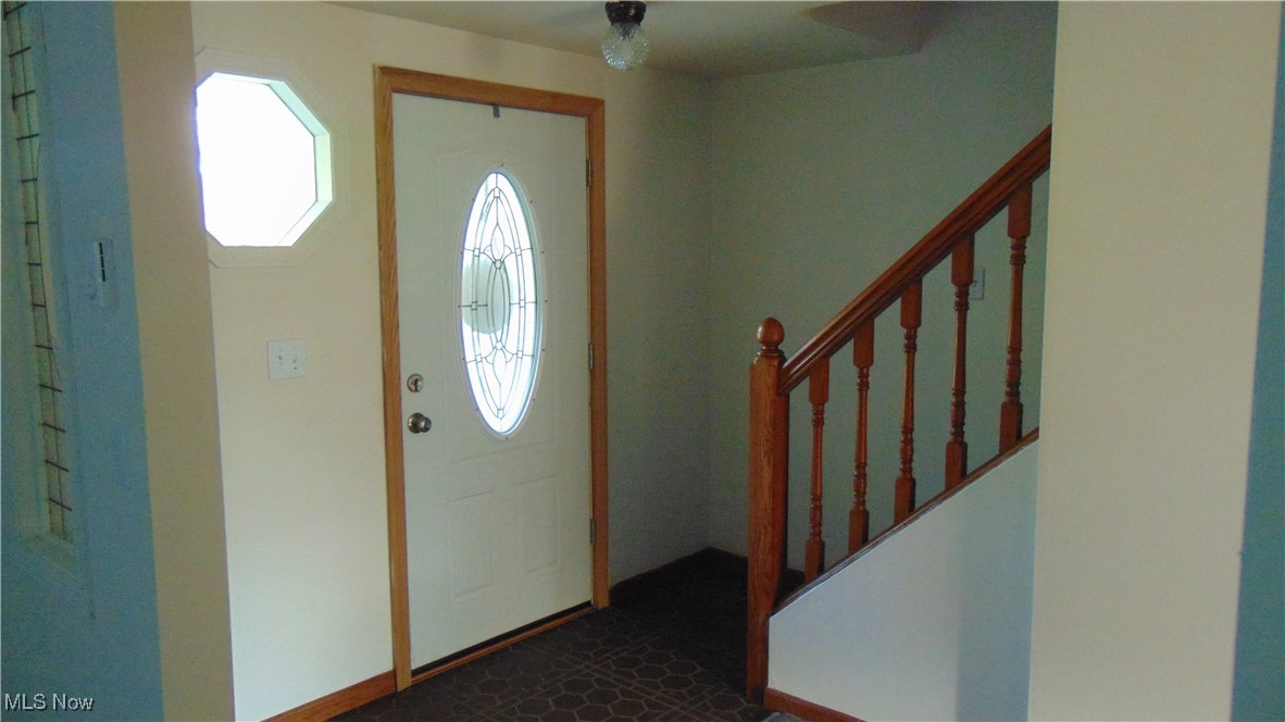 4970 Bryenton Road Litchfield, OH 44253 - Photo 7 of 33 Foyer with stairway and baseboards
