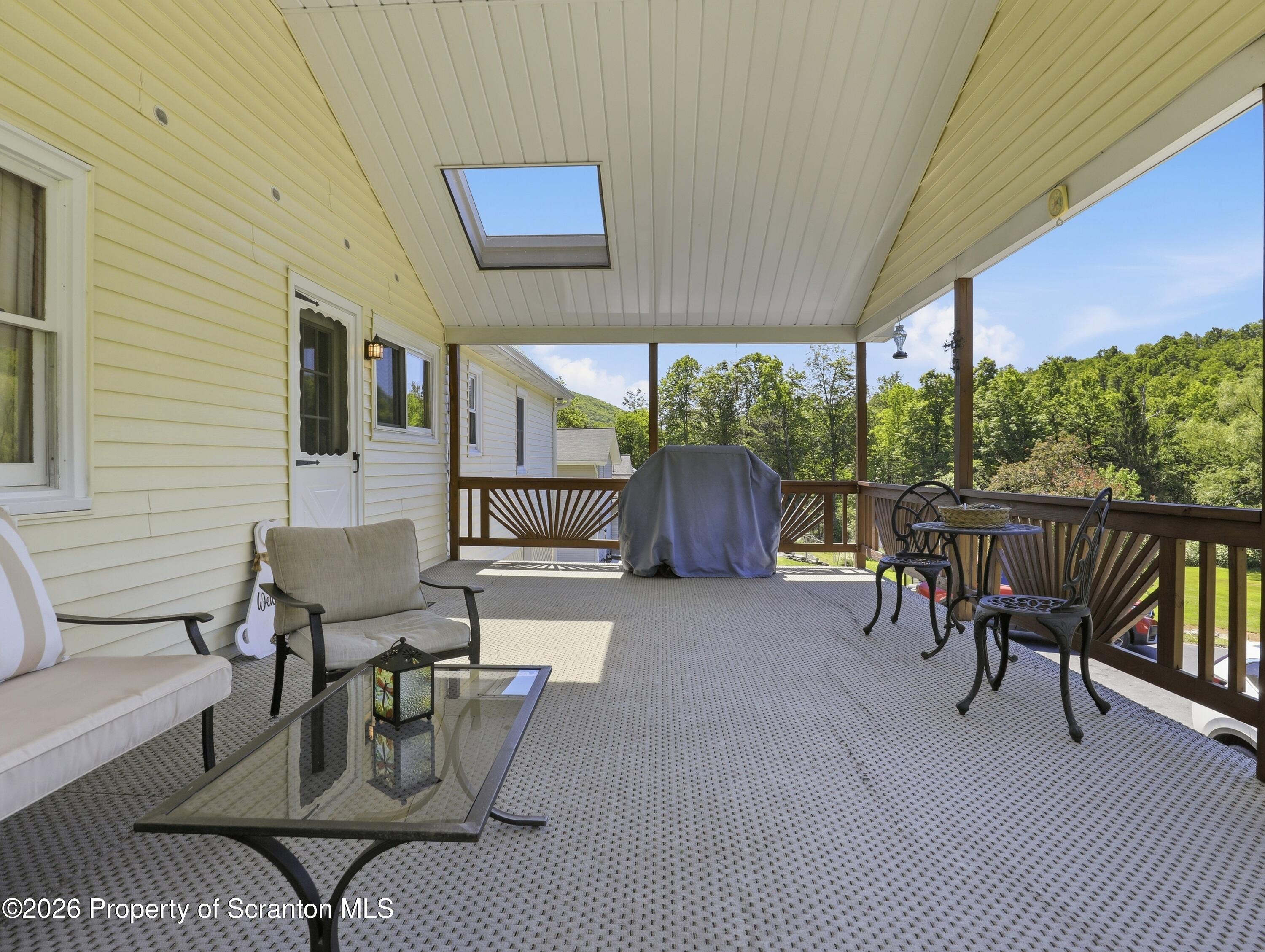 1237 Heart Lake Road Scott Township, PA 18433 - Photo 27 of 39 a patio with glass table and chairs
