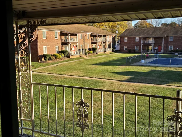 a view of a building from a big yard