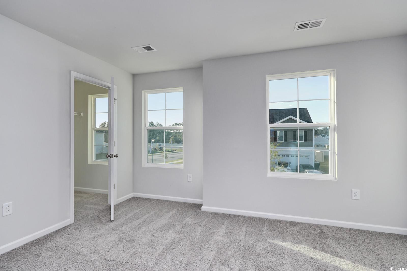 808 St Albans Loop Conway, SC 29526 - Photo 20 of 29 Empty room featuring carpet floors and baseboards