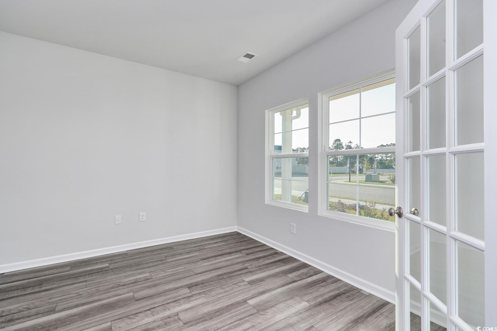 808 St Albans Loop Conway, SC 29526 - Photo 4 of 29 Spare room featuring wood finished floors and base