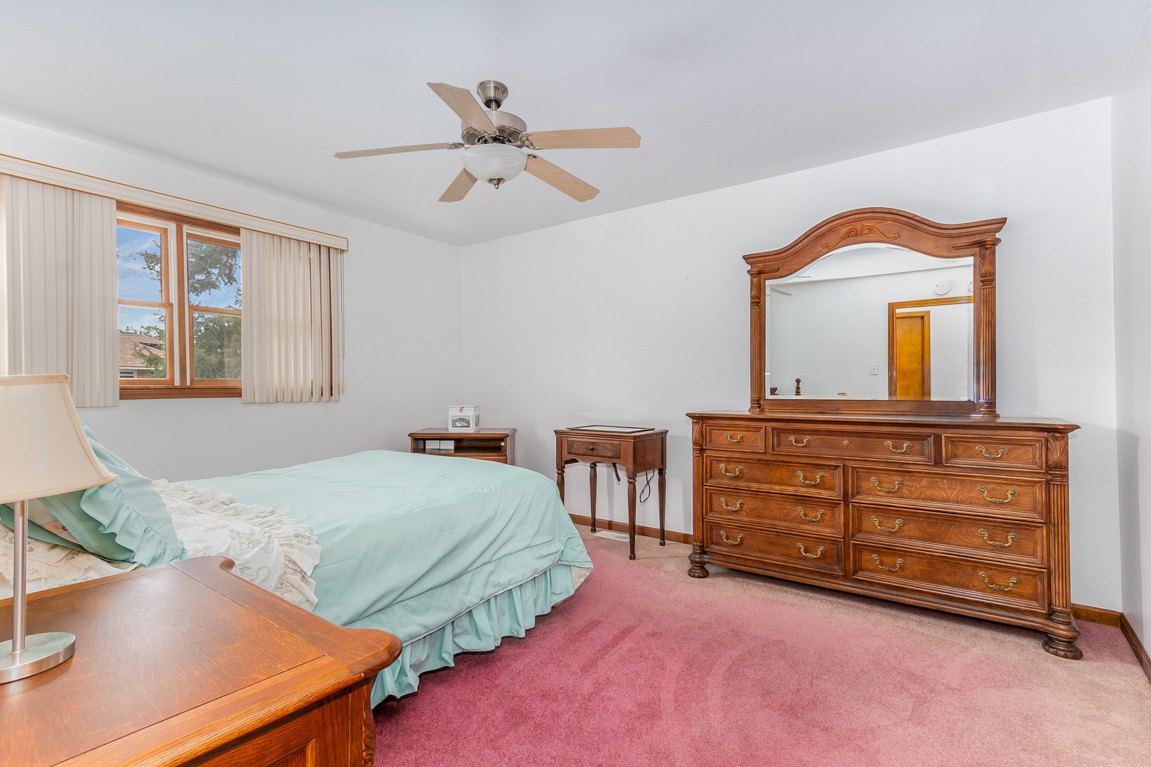 95 West 34th Street Steger, IL 60475 - Photo 15 of 21 a bedroom with a bed and a chandelier