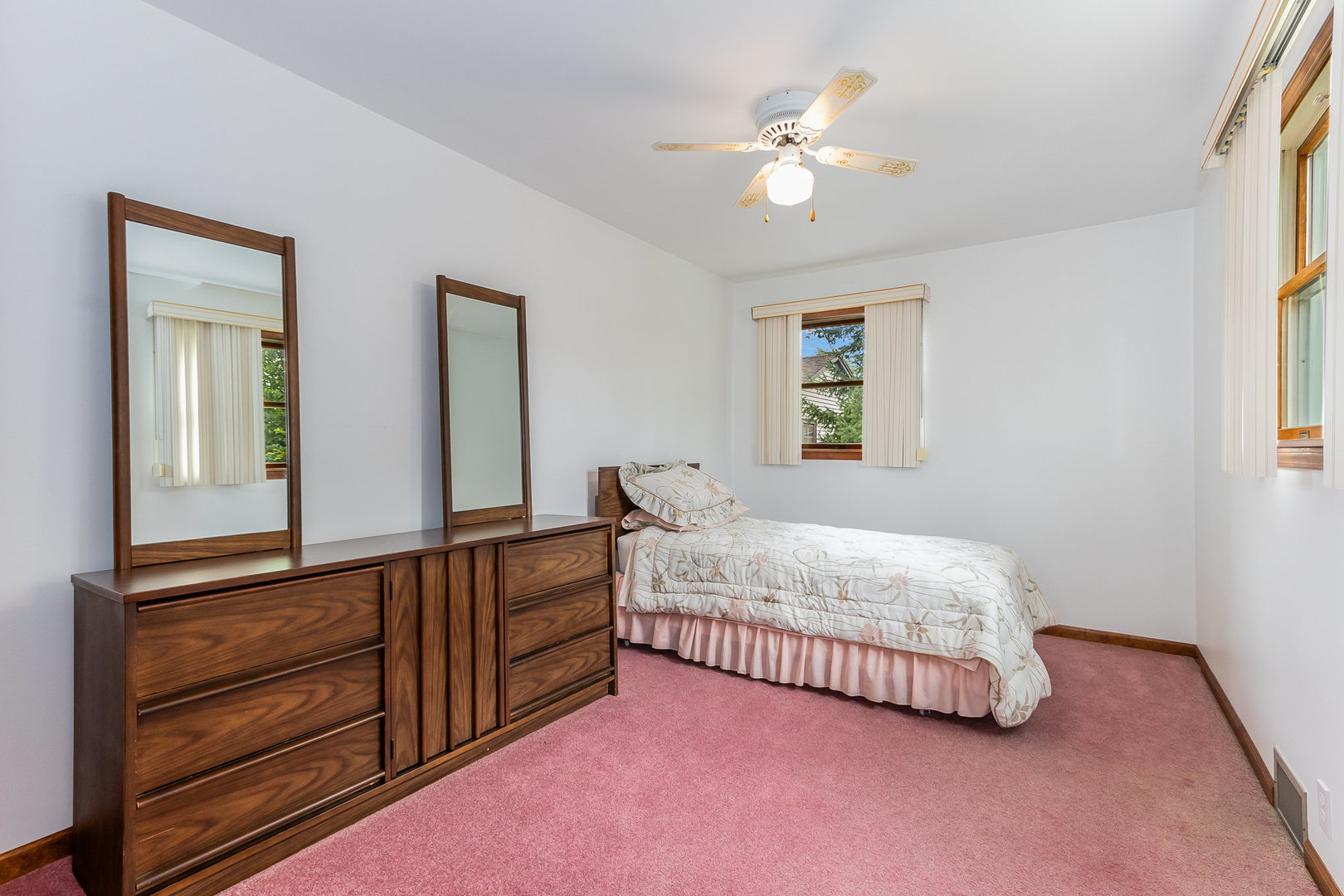95 West 34th Street Steger, IL 60475 - Photo 19 of 21 a bedroom with a bed and a chandelier