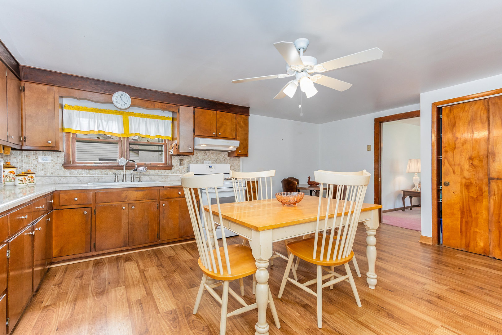 95 West 34th Street Steger, IL 60475 - Photo 10 of 21 a dining hall with stainless steel appliances granite countertop a stove a sink dishwasher and a dining table with wooden floor