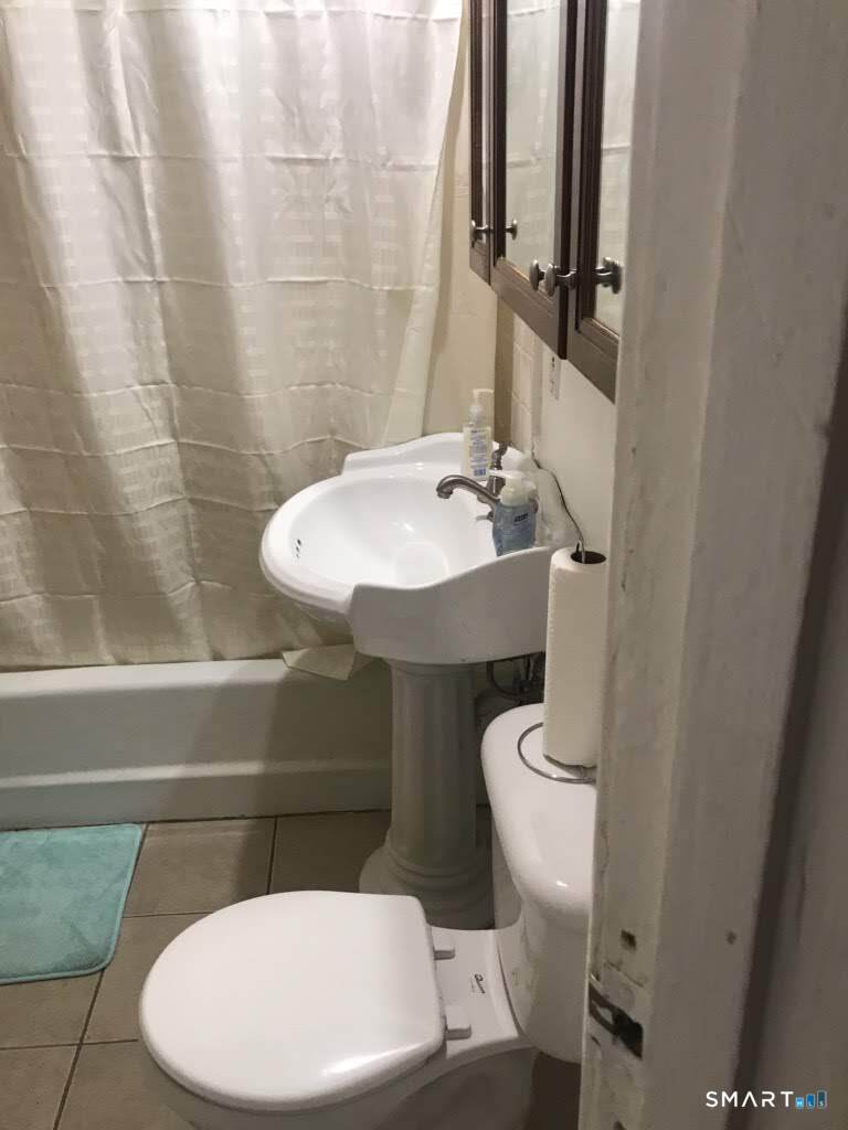 150 Whitney Street Hartford, CT 06105 - Photo 20 of 39 a bathroom with a sink and toilet