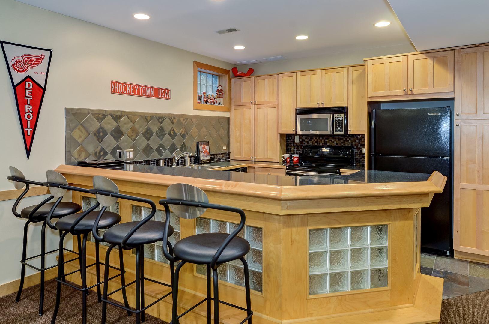 307 North County Line Road Hinsdale, IL 60521 - Photo 24 of 31 a kitchen with stainless steel appliances kitchen island granite countertop a sink and cabinets