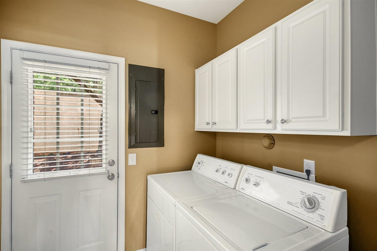 5527 Golden Arrow Lane Raleigh, NC 27613 - Photo 23 of 29 Laundry room with cabinets and washer/dryer included