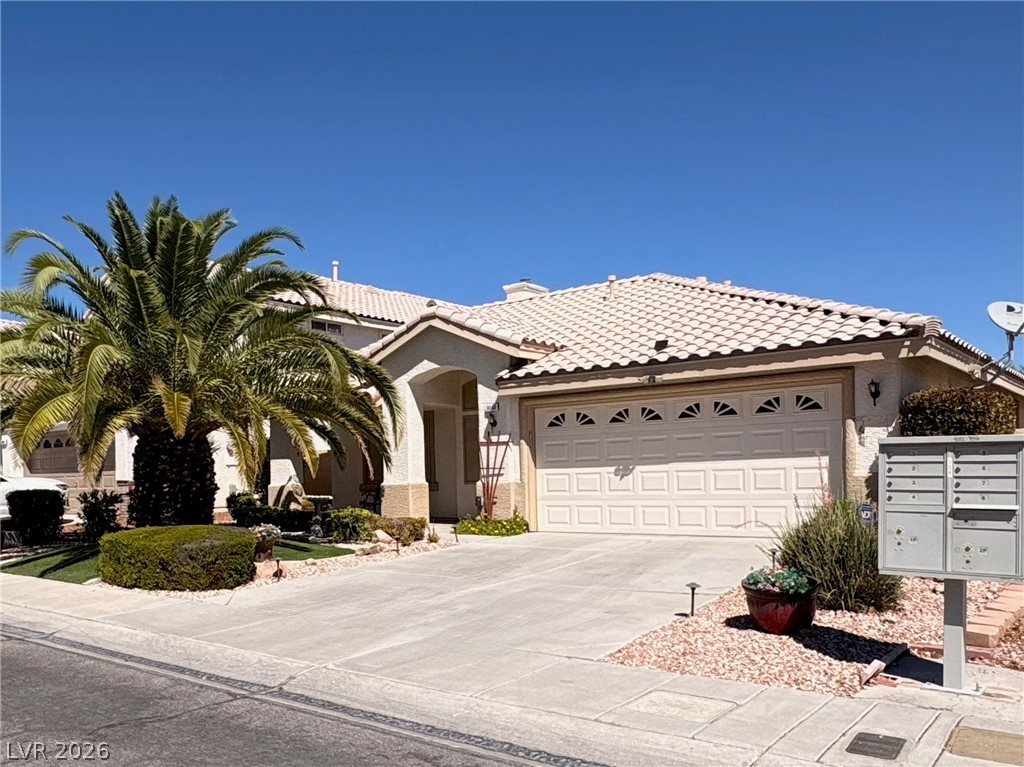 9040 Dove River Road Las Vegas, NV 89134 - Photo 2 of 22 Desert landscaping and a tiled roof enhance the curb appeal of this classic single-story home.