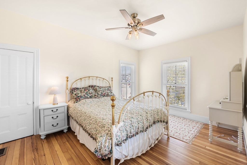 90 Puritan Road Swampscott, MA 01907 - Photo 28 of 42 a bedroom with a bed and a night stand