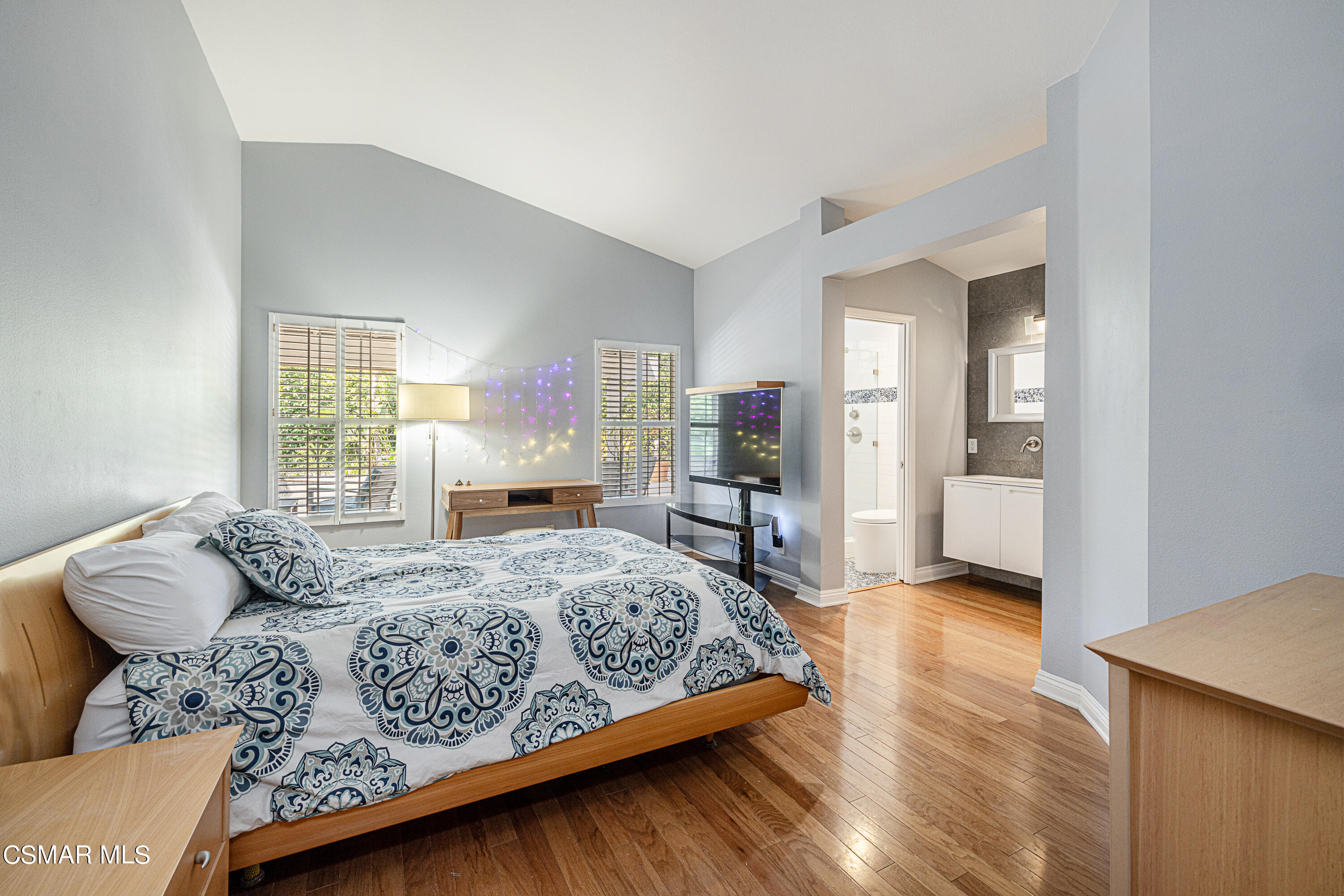 1703 Empty Saddle Road Simi Valley, CA 93063 - Photo 12 of 37 a bedroom with a large bed and a window
