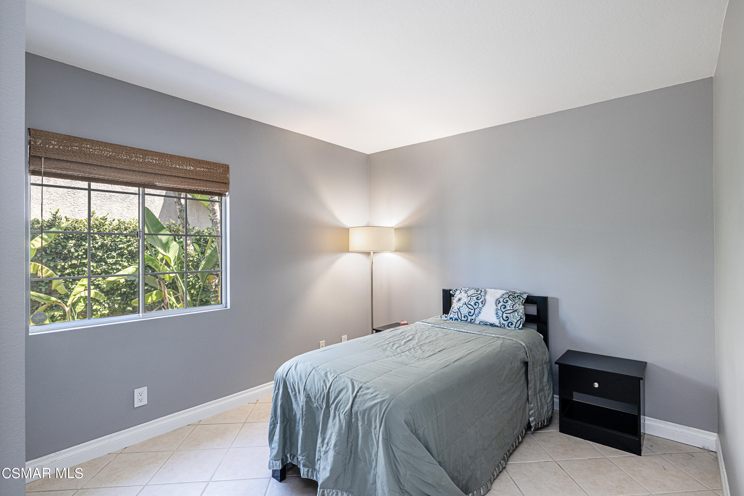1703 Empty Saddle Road Simi Valley, CA 93063 - Photo 17 of 37 a bedroom with a bed and a lamp on dresser