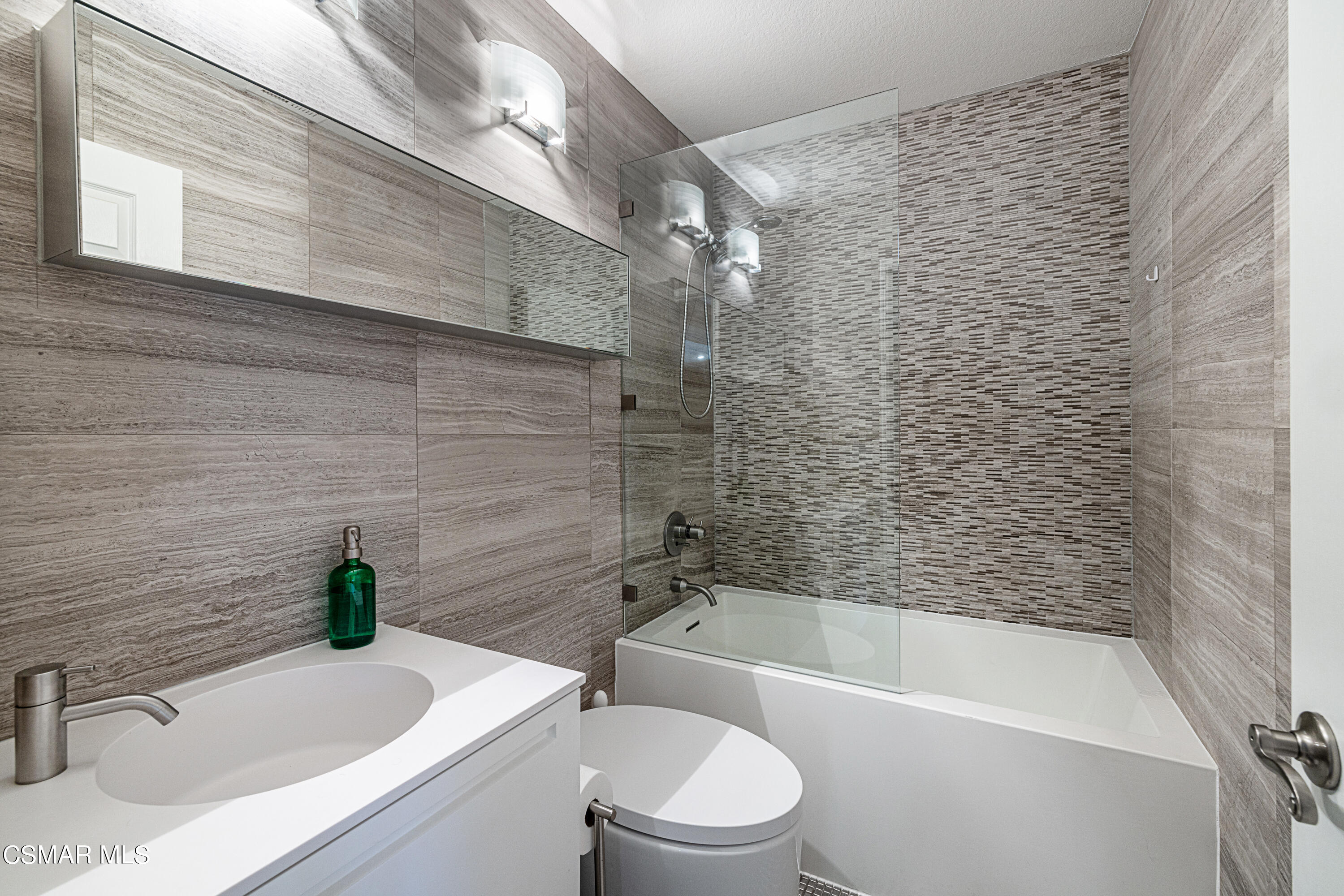 1703 Empty Saddle Road Simi Valley, CA 93063 - Photo 18 of 37 a bathroom with a sink a toilet and bathtub