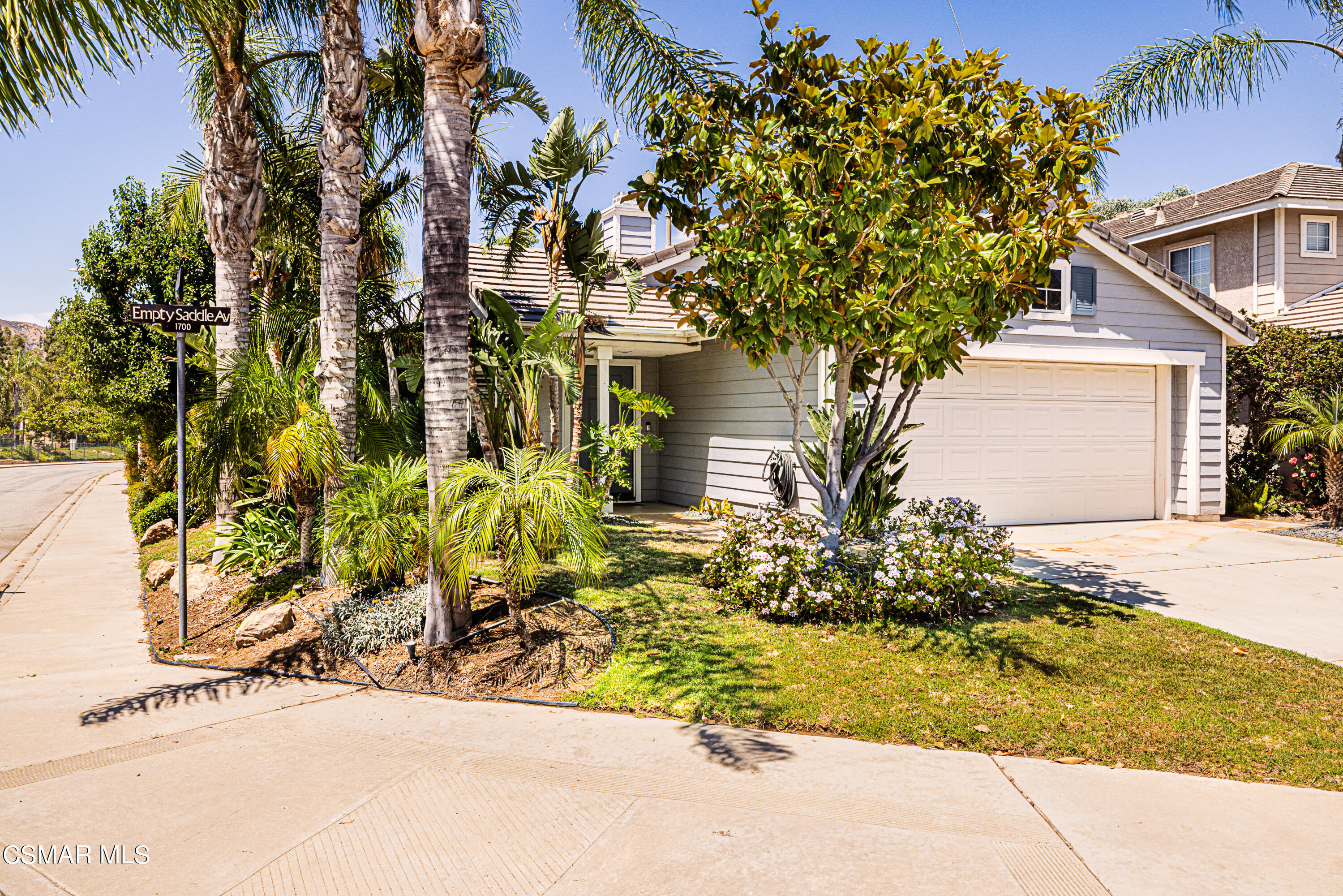1703 Empty Saddle Road Simi Valley, CA 93063 - Photo 32 of 37 front view of a house with a tree
