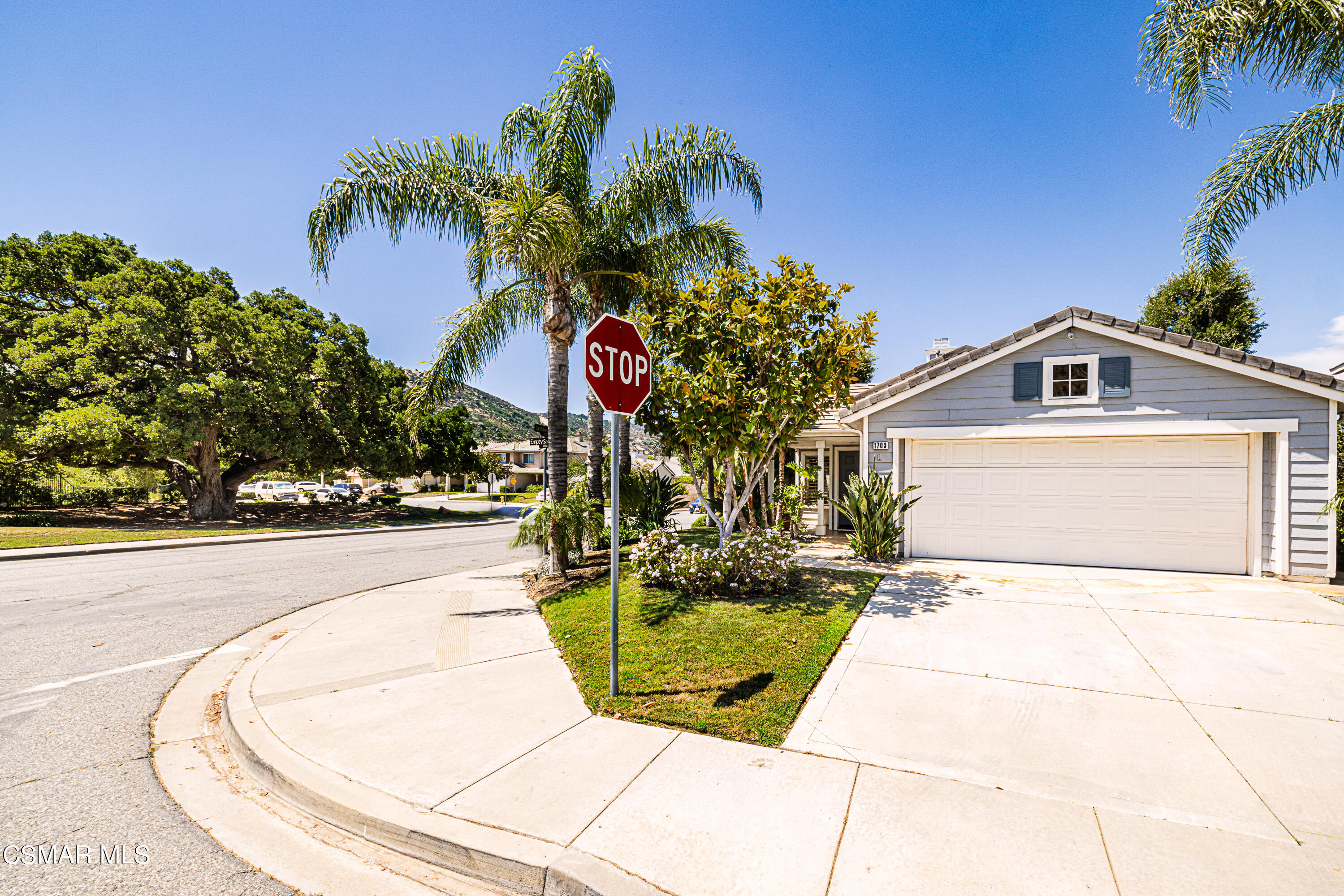 1703 Empty Saddle Road Simi Valley, CA 93063 - Photo 33 of 37 a view of a house with a yard and potted plants