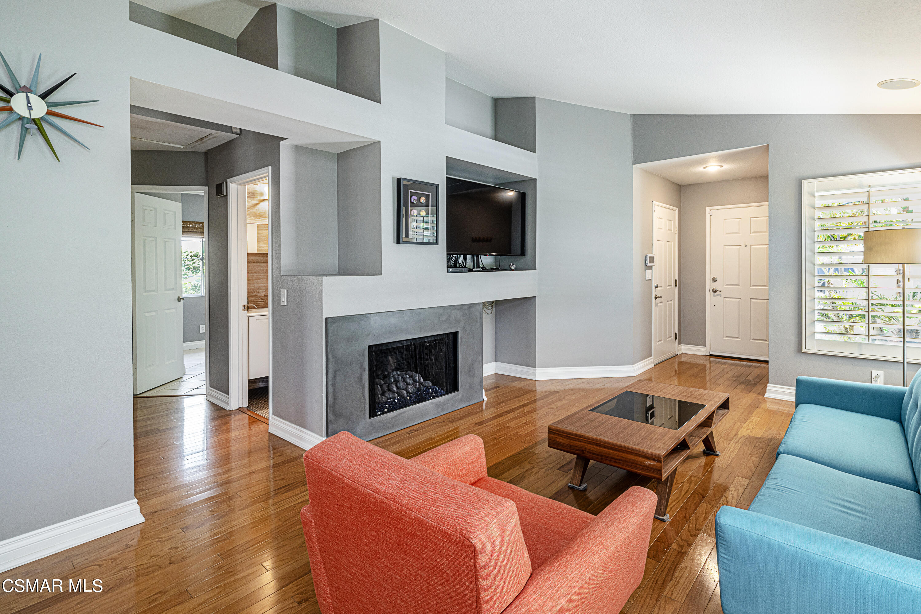 1703 Empty Saddle Road Simi Valley, CA 93063 - Photo 4 of 37 a living room with furniture fireplace and flat screen tv