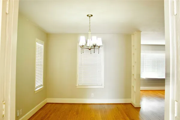 a view of a room with a windows and a chandelier