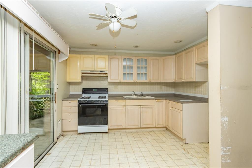 1736 Maple Road New Bethlehem, PA 16242 - Photo 13 of 22 a kitchen with stainless steel appliances granite countertop a stove a sink and white cabinets